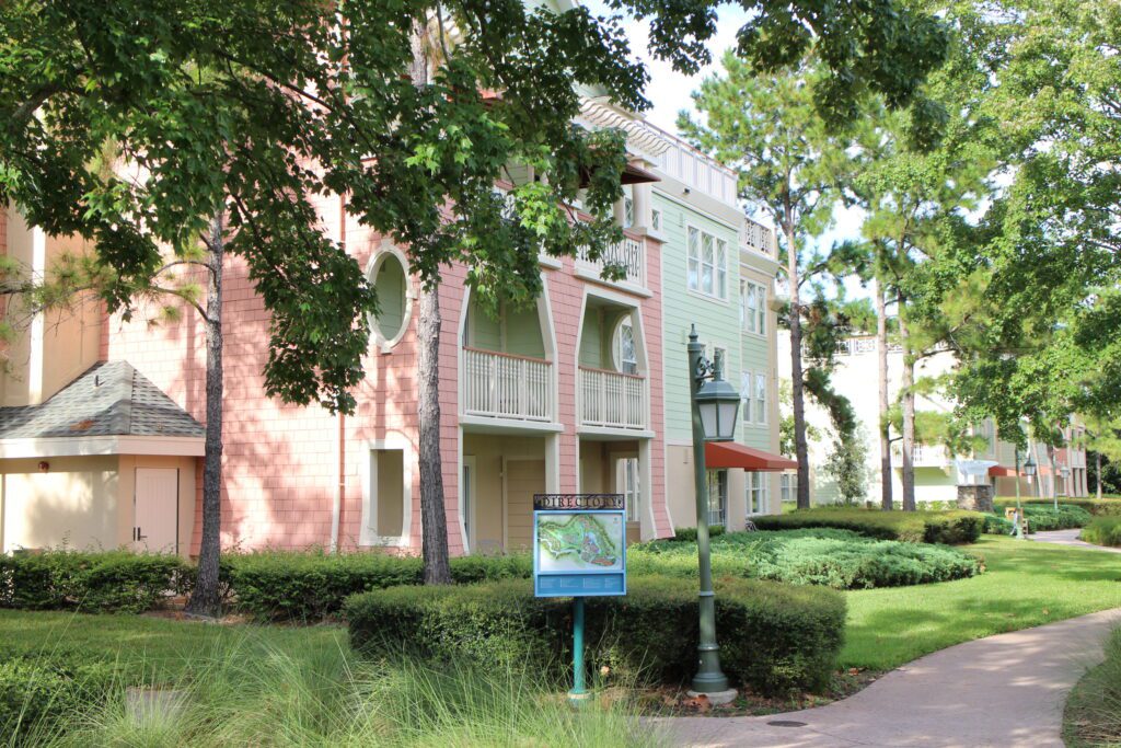 Saratoga Springs Resort and Spa pastel pink and mint multistory building surrounded by trees
