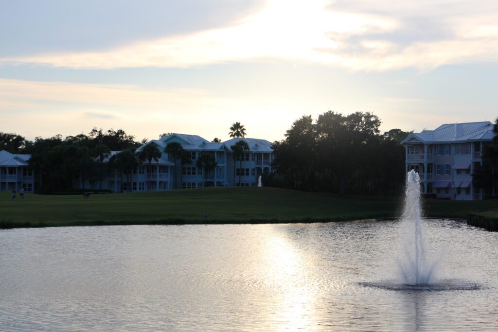 A place guests can view fireworks from Old Key West resort is pictured, above the pastel buildings surround this body of water with a fountain
