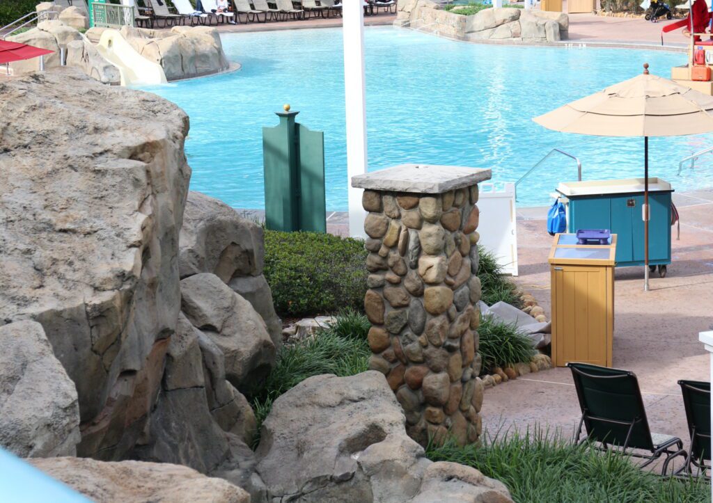 An overhead view of a pool surrounded with rock work and stone accents