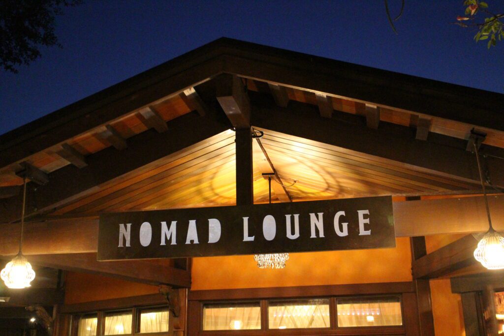 The brown, wood and natural texture front of Nomad Lounge, a Disney World bar at Animal Kingdom.