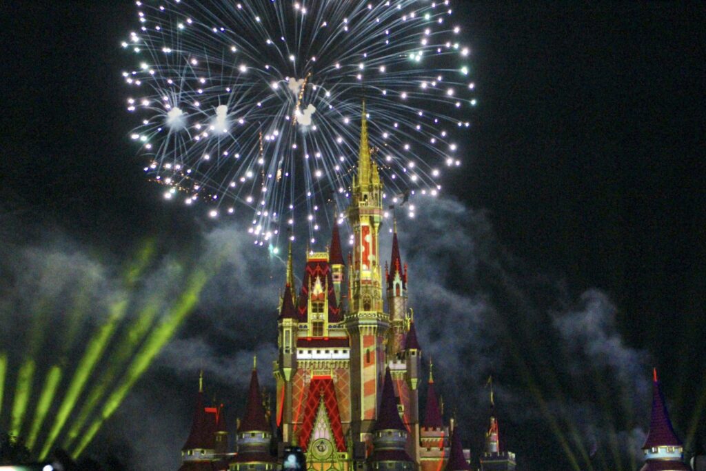 The holiday themed Disney World fireworks over the castle.