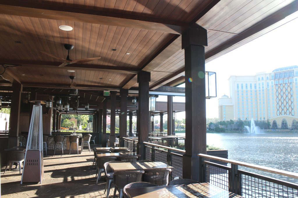 Waterfront, open air yet covered Three Bridges Bar & Grill at Villa del Lago at Coronado Springs.