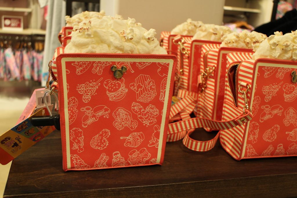 A red popcorn box purse at Disney World.