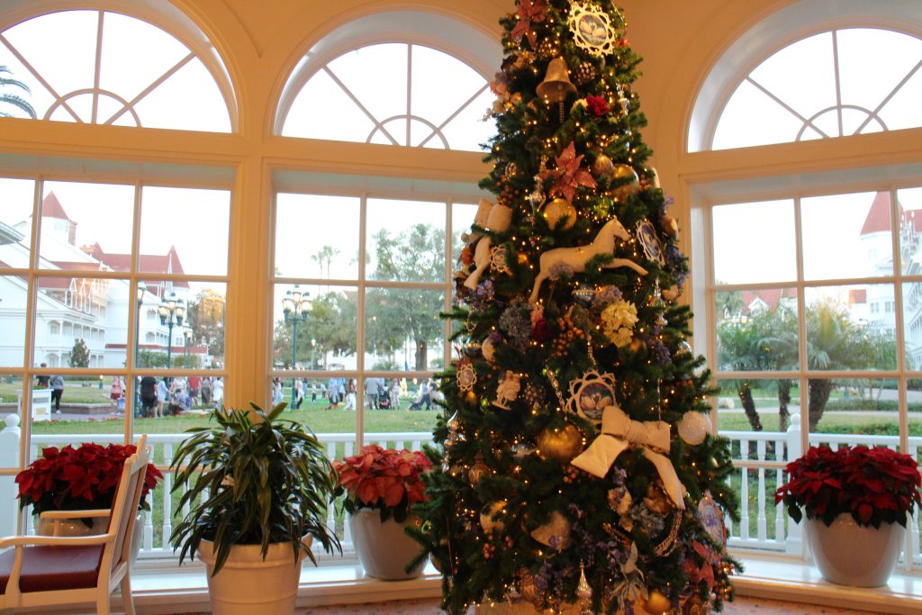 Grand Floridian tea room with tall windows and a Christmas tree.