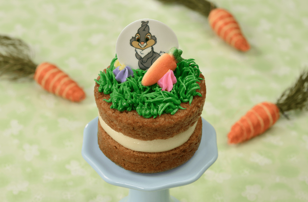A mini carrot cake with Thumper on frosting grass on top.
