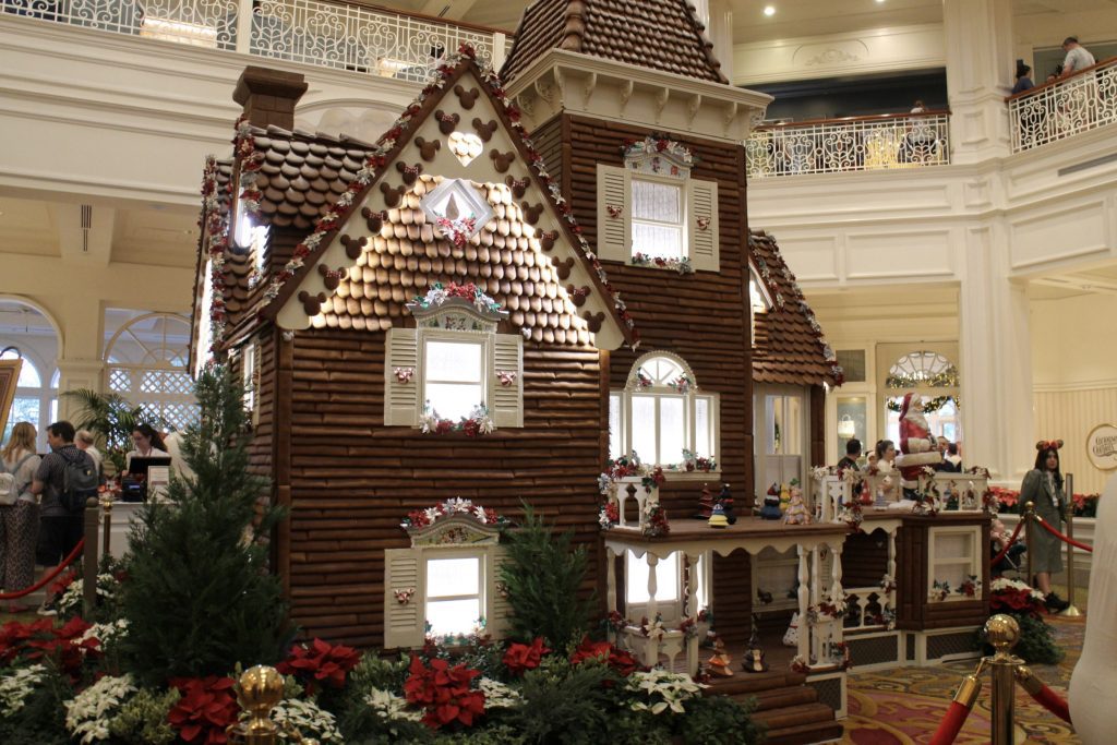 The Grand Floridian life size gingerbread house in the lobby decorated for Christmas.