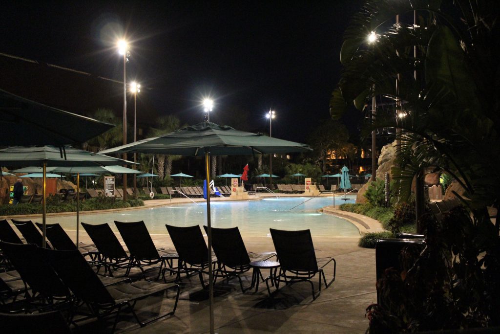 A nighttime, zero entry pool scene.