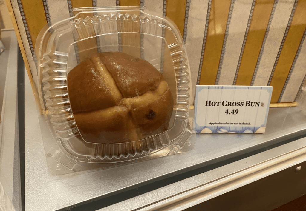 A Hot Cross Bun in a plastic clam shell package listed for $4.49.