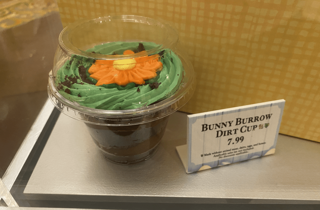 The Bunny Burrow Dirt Cup with cookie crumble bottom, layers and a green frosted top with a confection flower on it for $7.99.