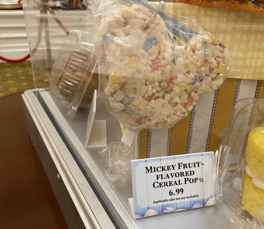 A multi color Mickey crispy treat on a stick shown for $6.99.