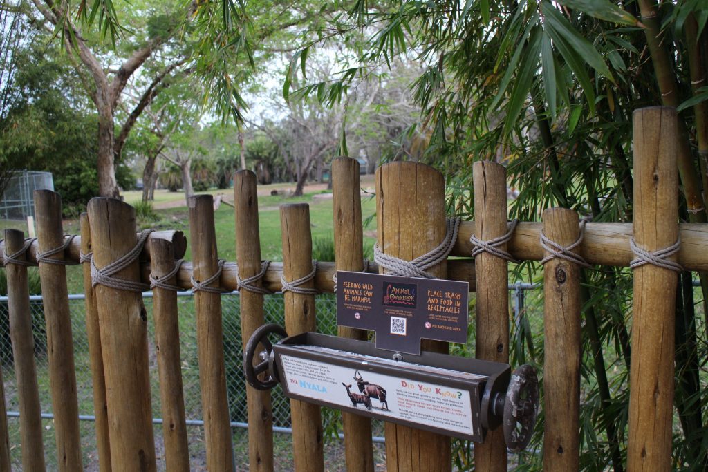 A view over a wooden fence at the Pembe Savanna at Kidani Village.