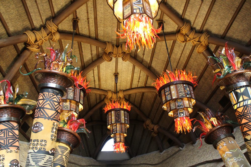 Orange fire looking chandeliers in a natural toned lobby interior at Animal Kingdom Villas Kidani Village.