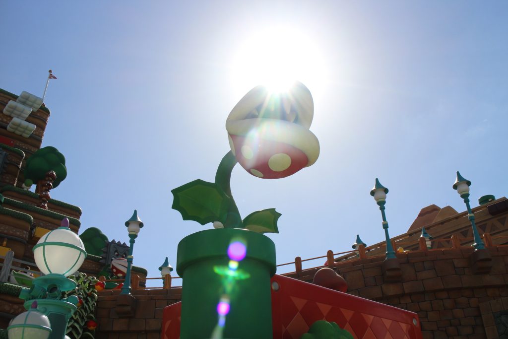 A plant in a green pipe in the Epic Universe Super Mario land.
