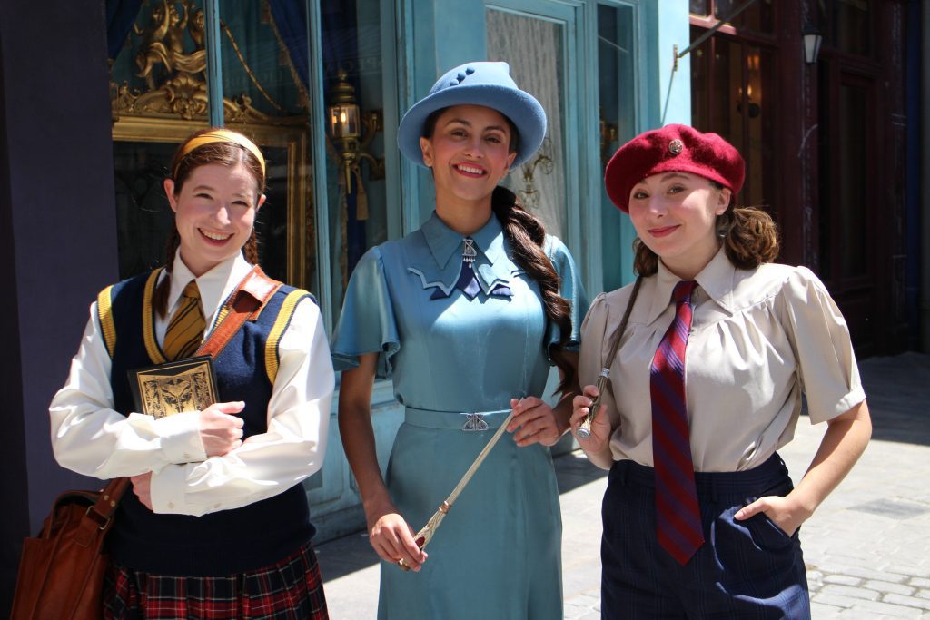 Wizarding students roaming the land at Epic Universe.