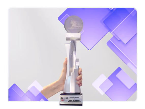 Hand holding an R and D award trophy against a purple graphic background