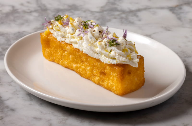 A close-up of freshly baked cake at No.FortyNine — vibrant ingredients, carefully plated