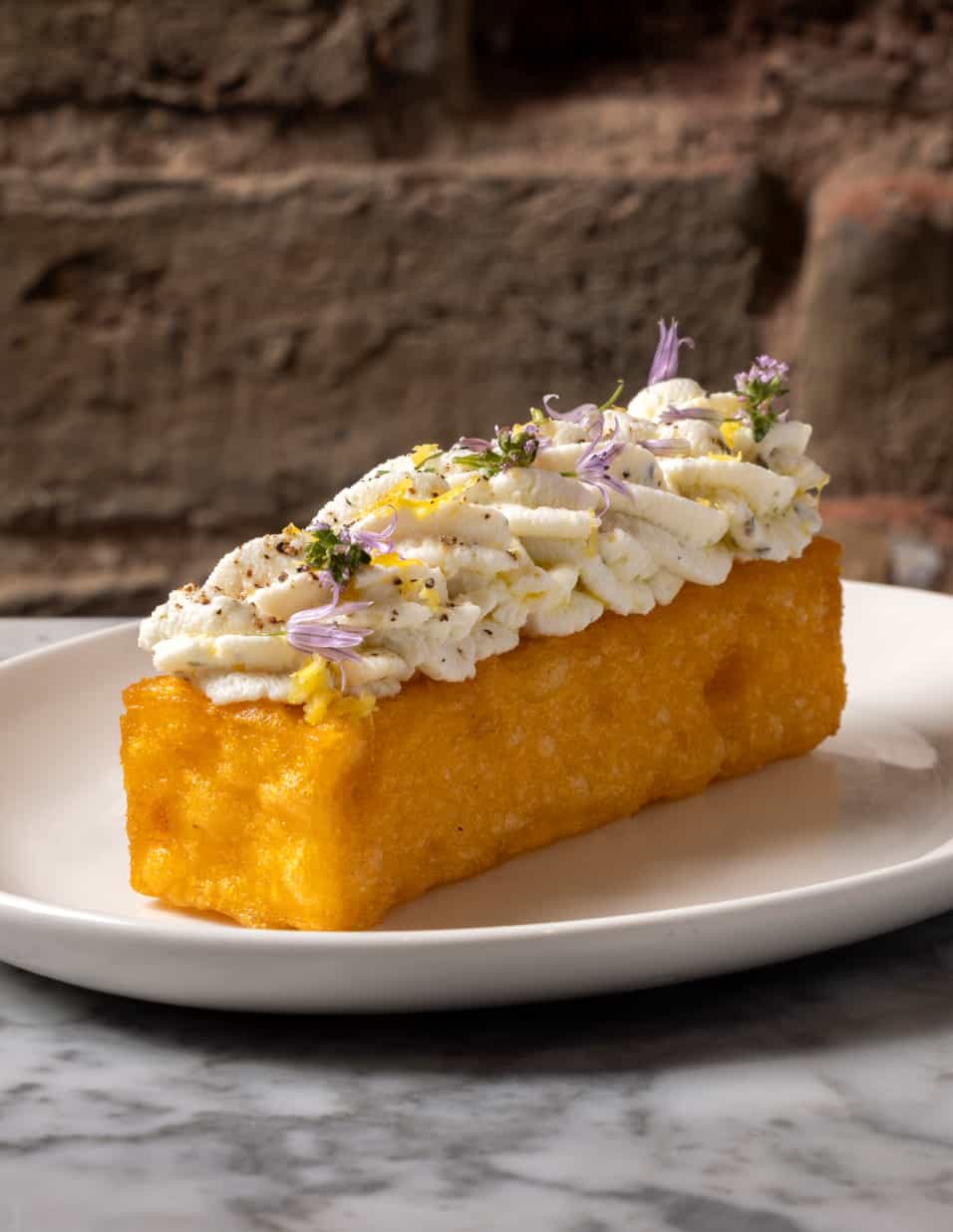 A close-up of freshly baked cake at No.FortyNine — vibrant ingredients, carefully plated