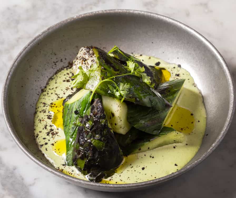 A close-up of freshly made dishes at No.FortyNine — vibrant ingredients, carefully plated