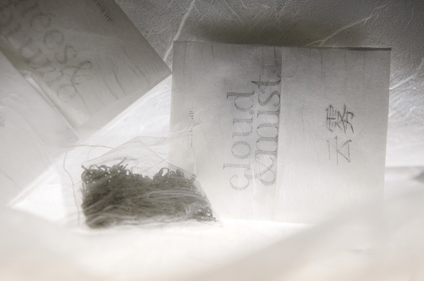 Hero image shot of the Cloud & Mist tea packaging, arranged with decorative Japanese papers.