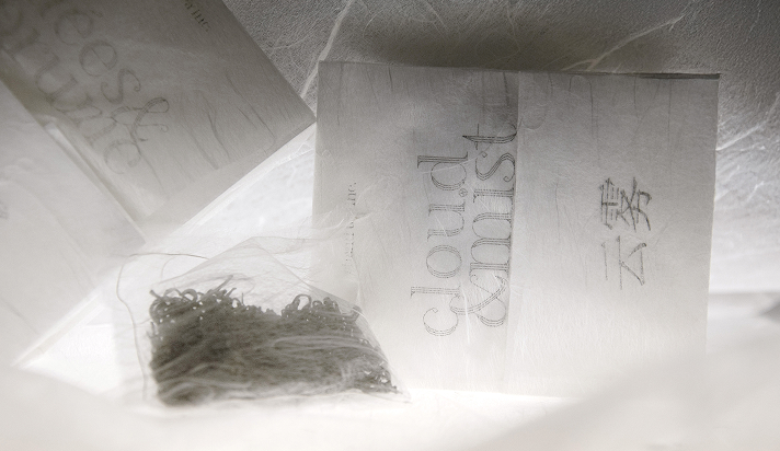 Hero image shot of the Cloud & Mist tea packaging, arranged with decorative Japanese papers.