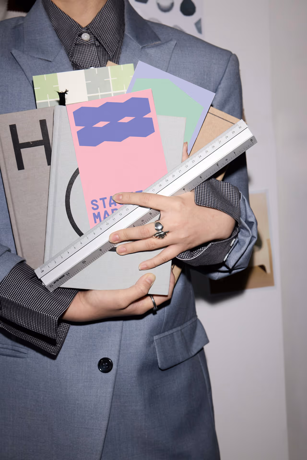 Businesswoman holding a copy of a Stackt postcard.