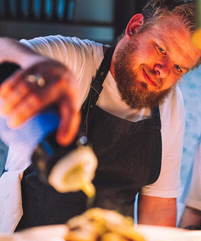 cinematic image of chef preparing food