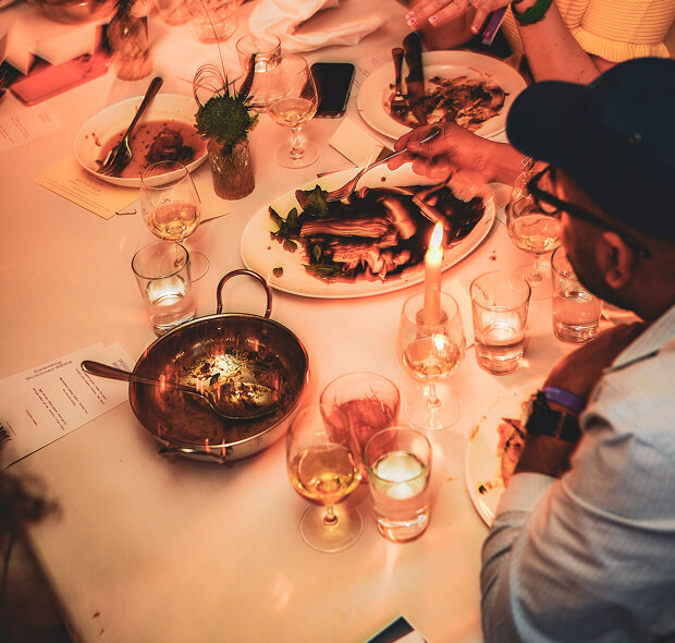 people gathered at table eating food