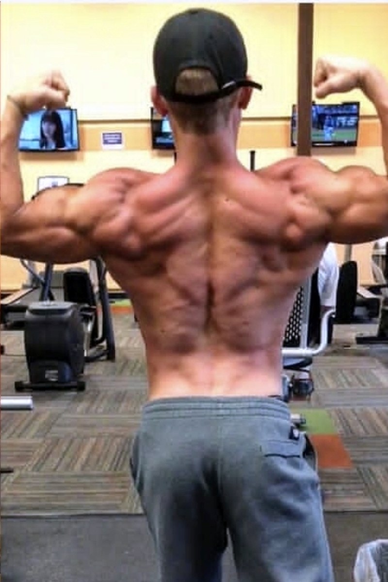 Caleb S. photographed from behind after six months of coaching