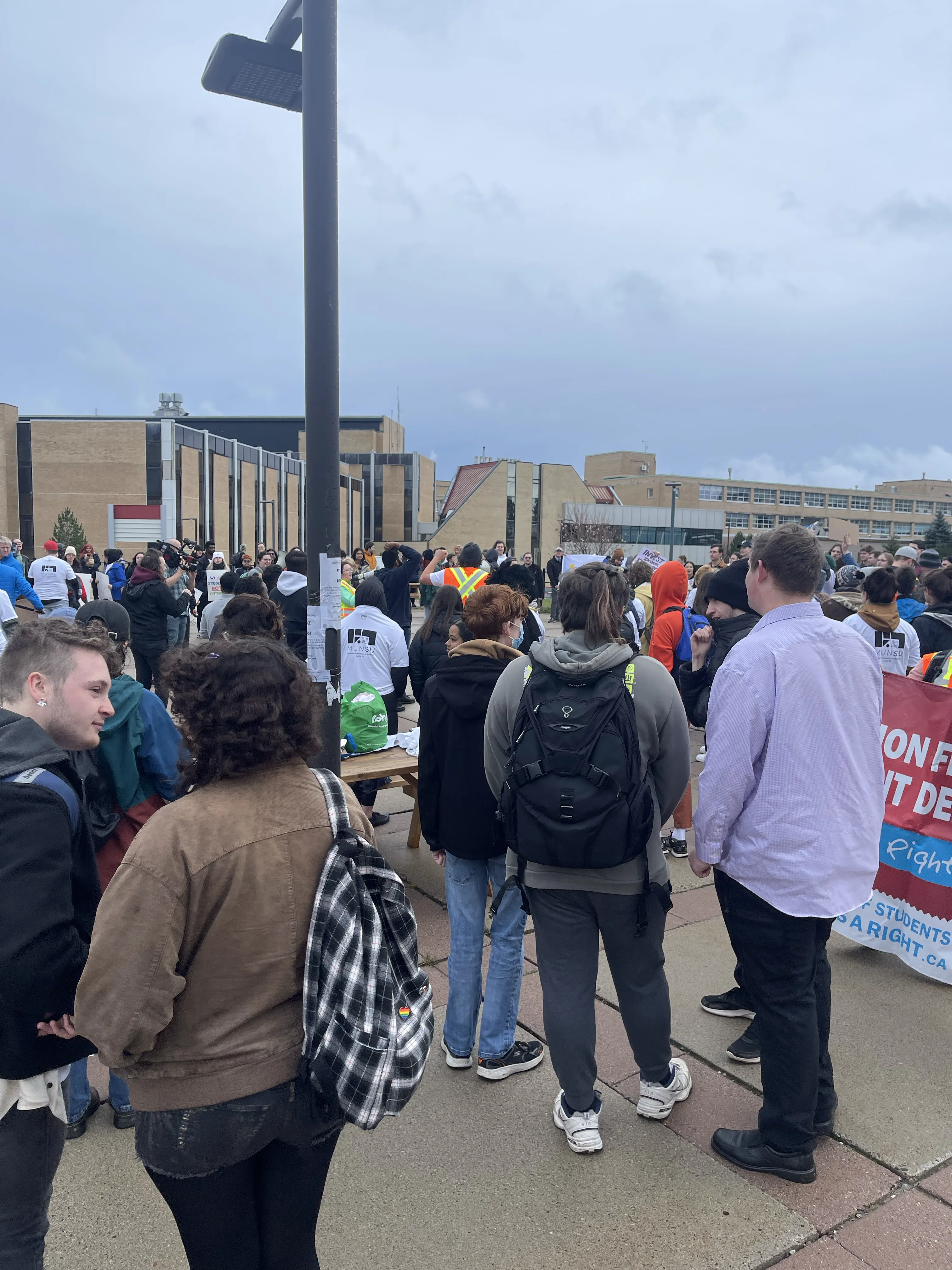 A group of people at a rally or protest at Memorial University