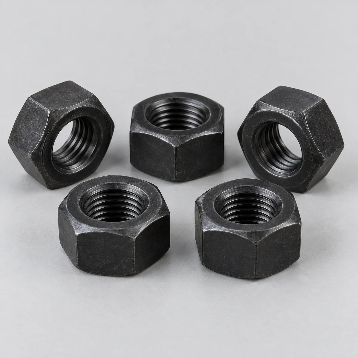 Hex Nut - DIN 934 family, steel, black finish, internal thread detail (product illustration)