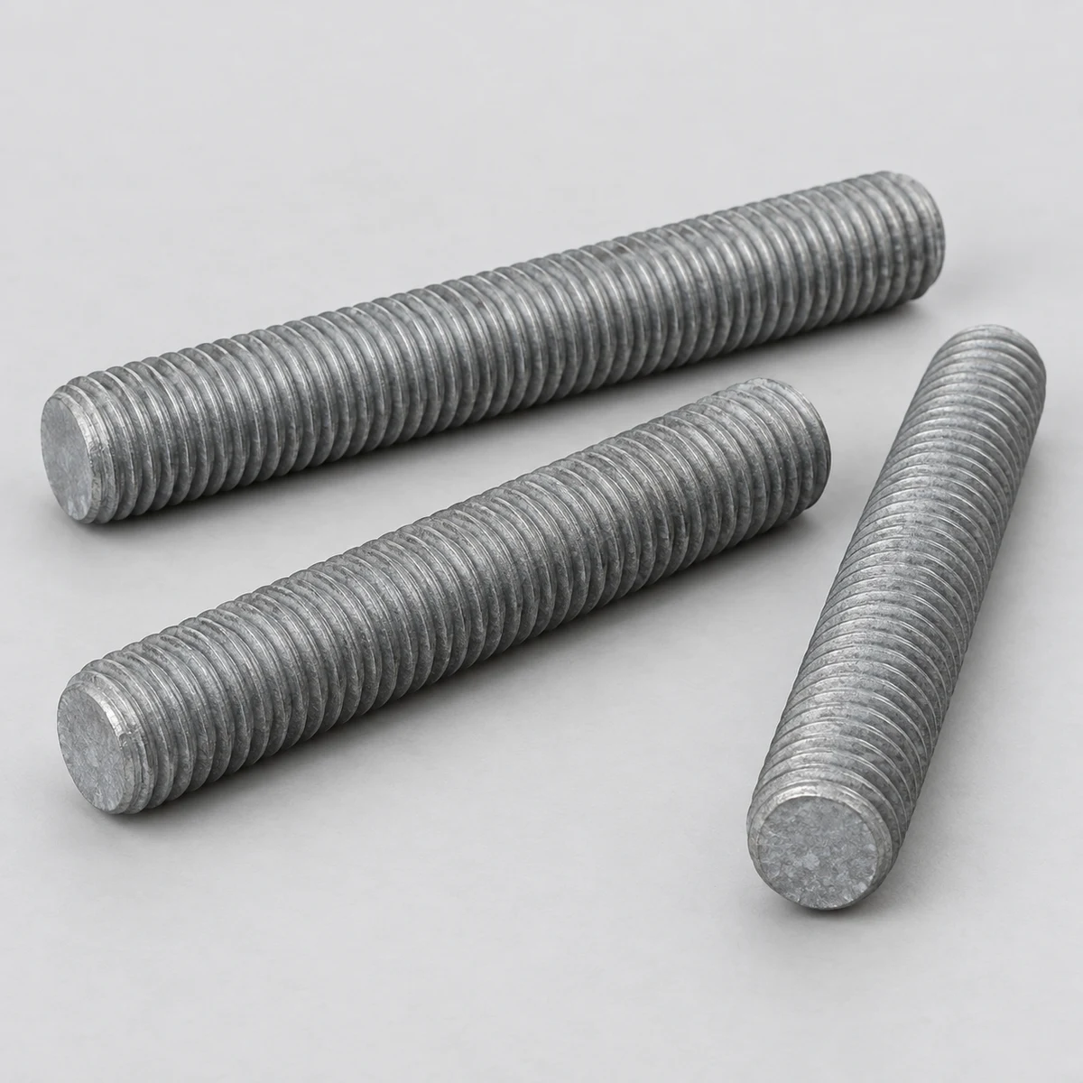 Hot Dip Galvanized B7 Threaded Rod - ASTM A193 B7 alloy steel, hot-dip galvanized, three all-thread rods (product illustration)