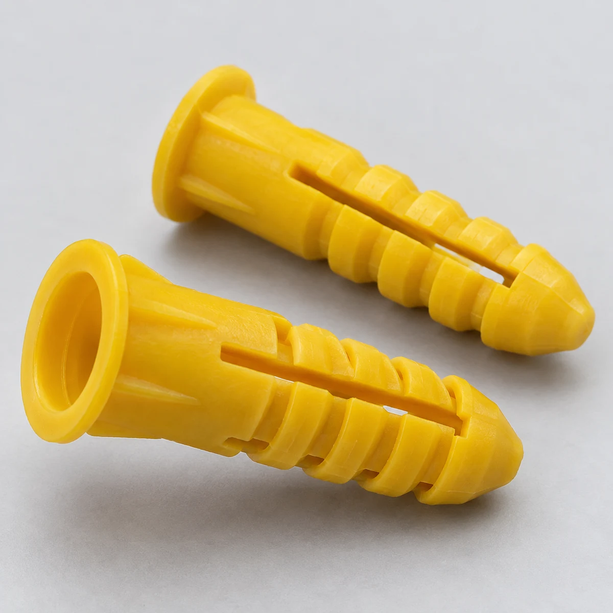 Plastic Wall Plug - yellow nylon (product illustration)