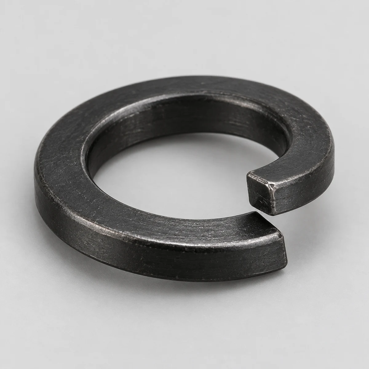 Spring Washer - DIN 127 family, steel, black finish, helical split-end detail (product illustration)