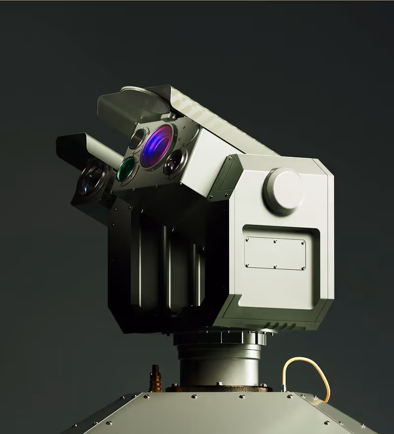 Close-up of a high-tech military or surveillance turret with multiple lenses on a dark background.
