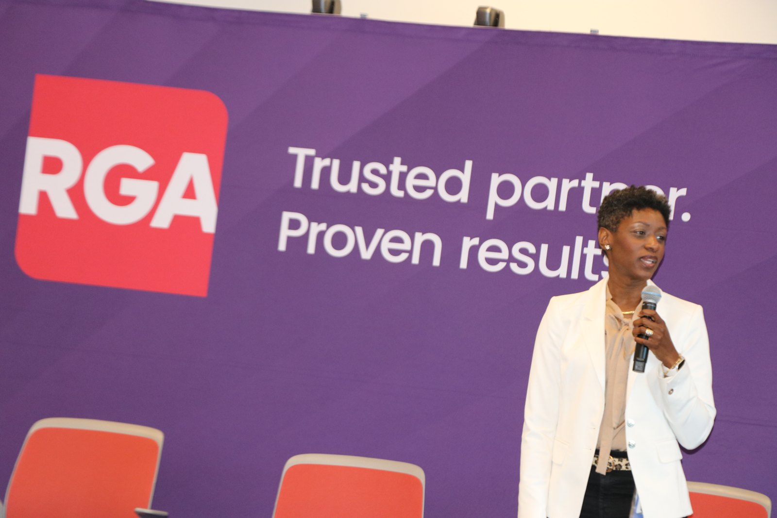 Businesswoman speaking at corporate professional panel