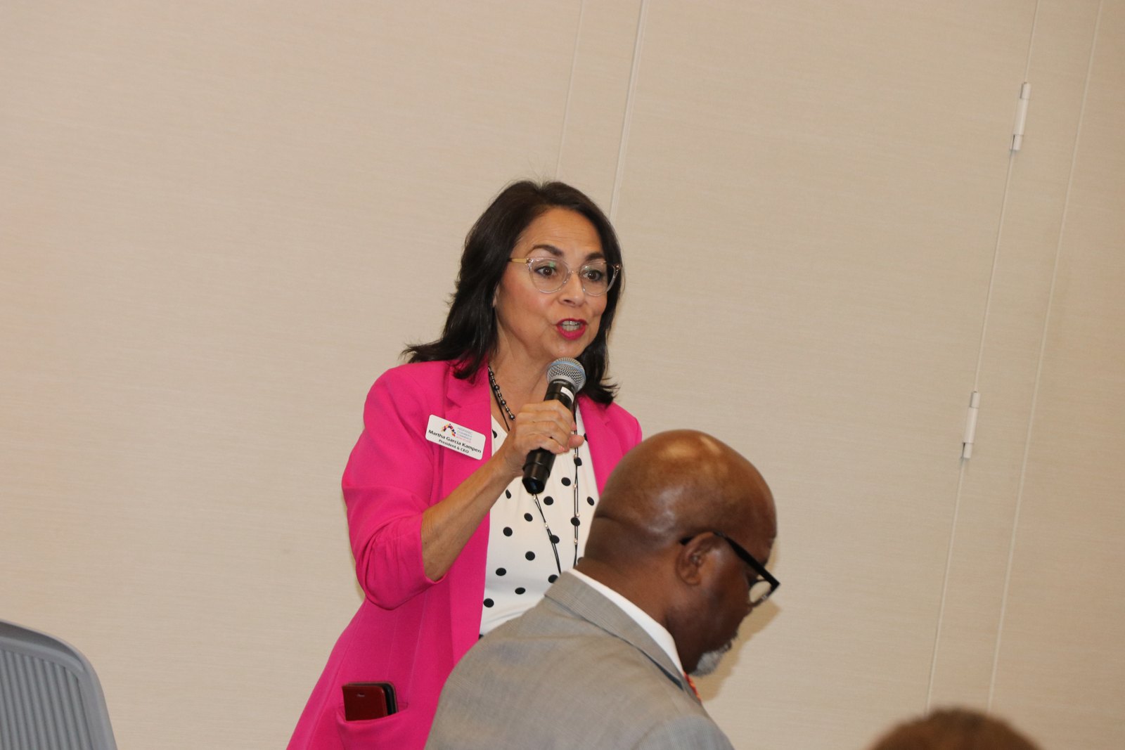 Female speaker presenting to SMPHR audience members