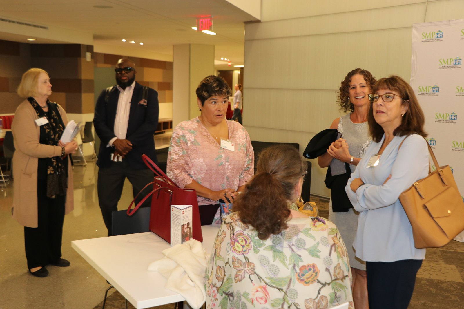 Multiple attendees at SMPHR networking event