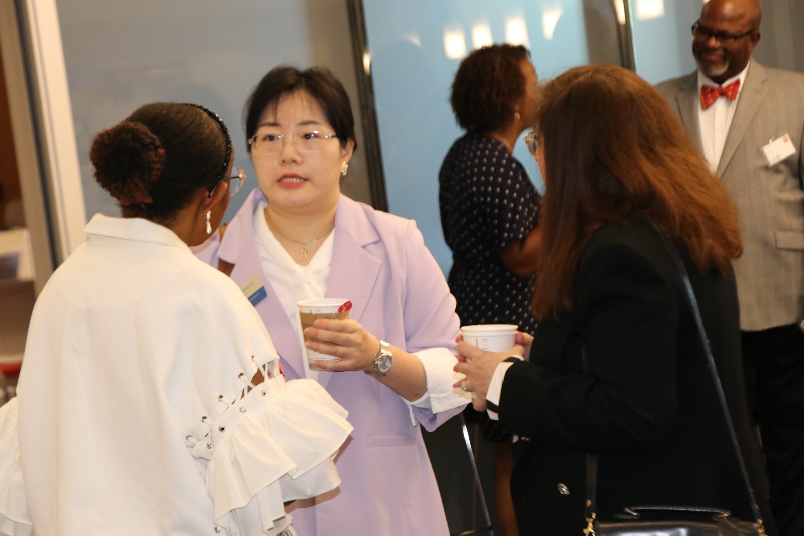 Woman in lavender blazer at SMPHR event