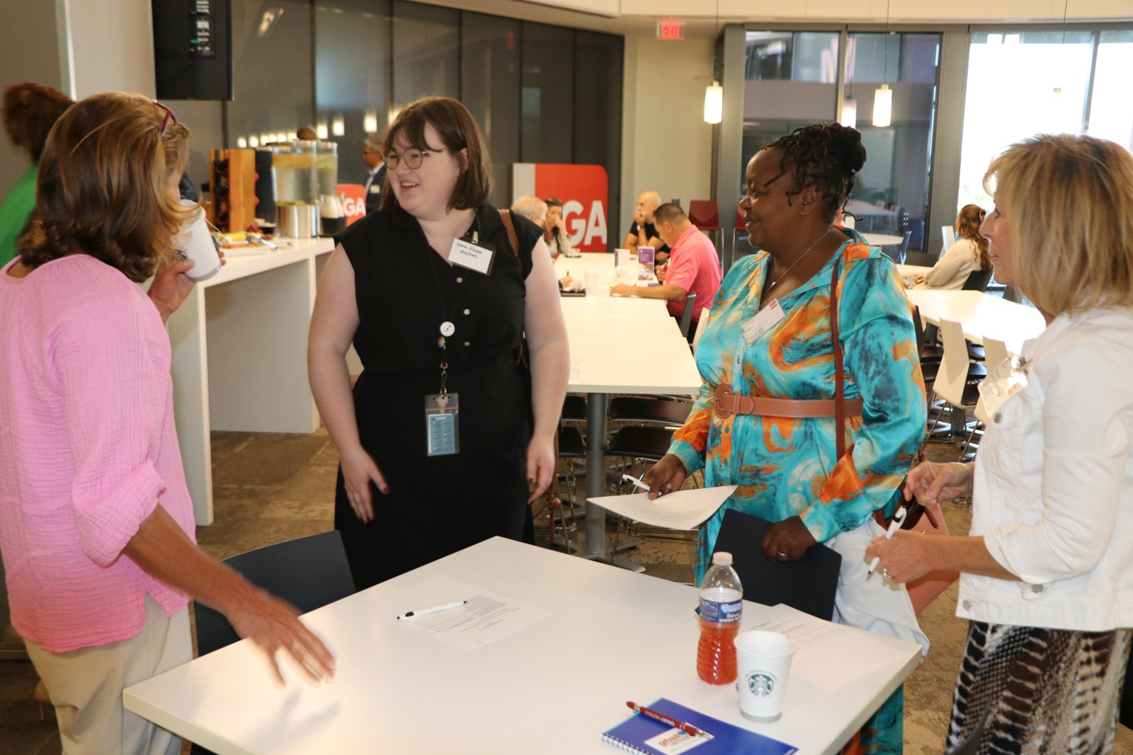 Professionals networking over food at an SMPHR reception event