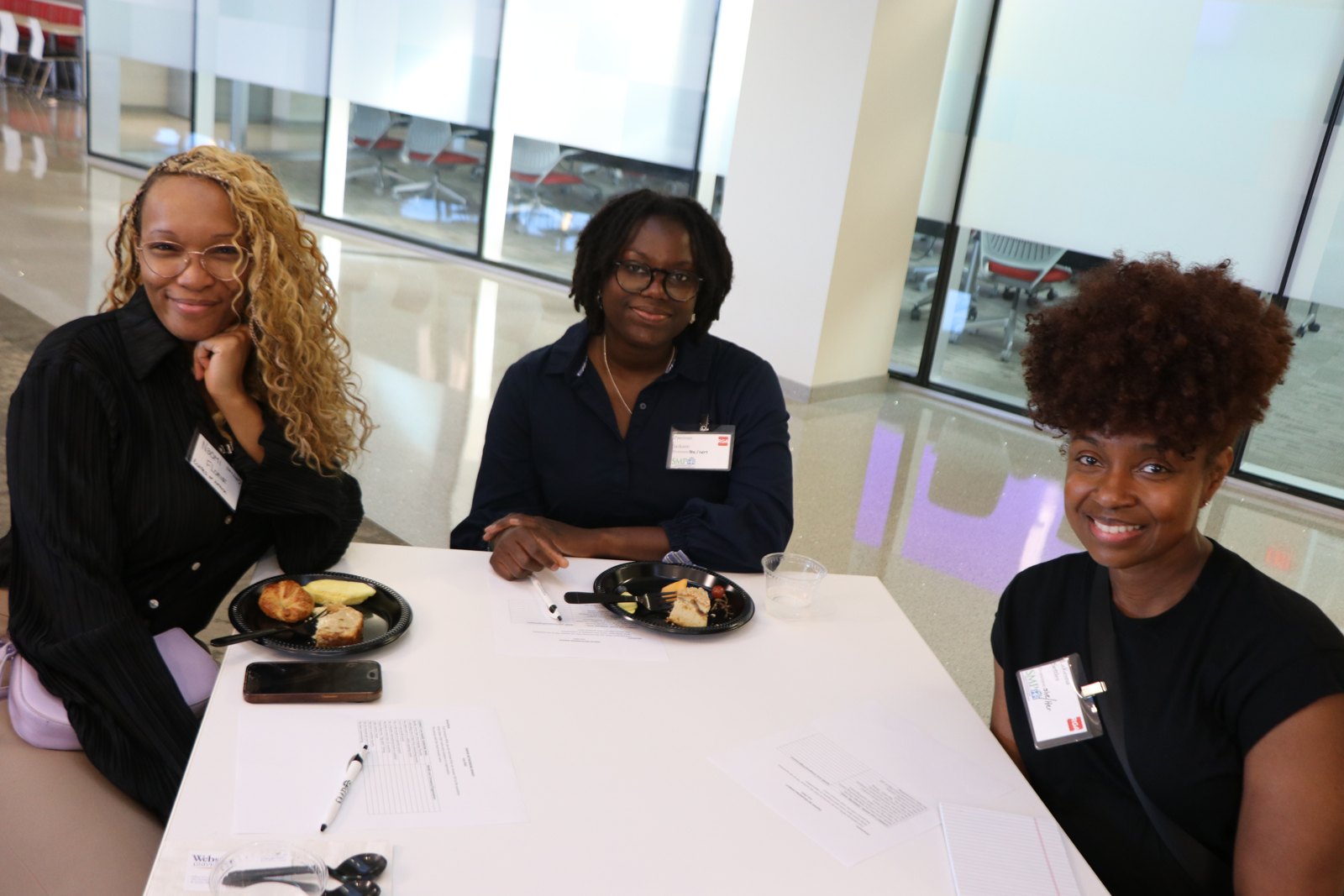 Three SMPHR members dining and networking at professional event