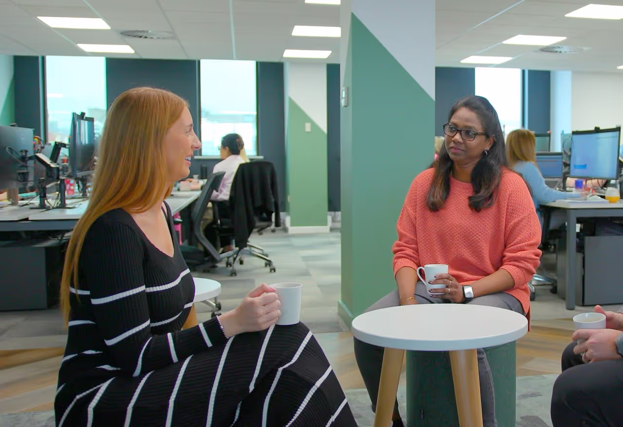 Two colleagues having an informal meeting over coffee