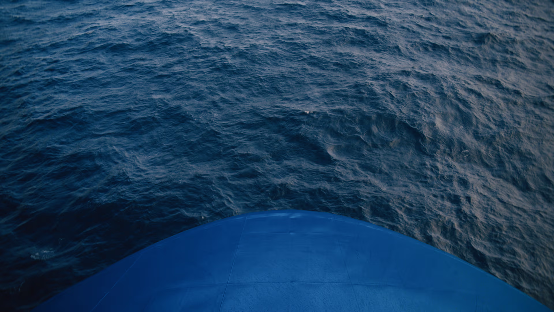 Top down view of a blue bow of a ship