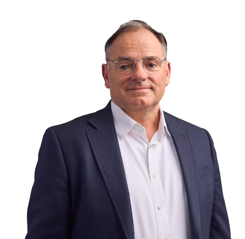 A man in a suit and glasses posing for a picture.