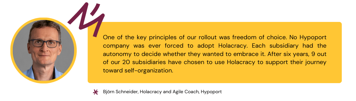 Quote from Björn Schneider that explains that the rollout of self-organization with Holacracy was based on freedom of choice
