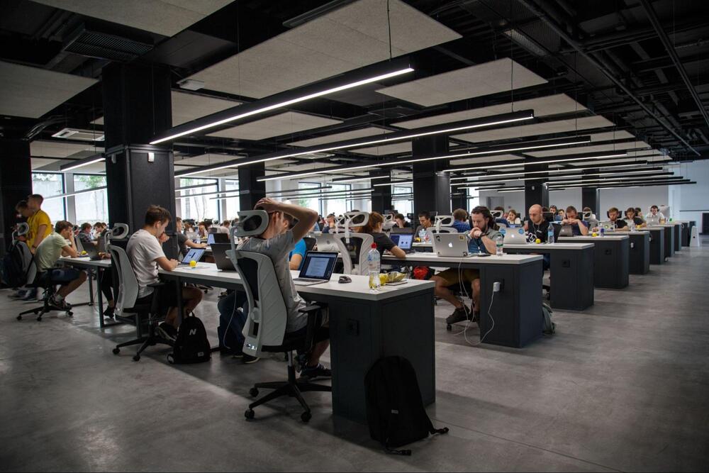 Employees working in a hot desk agile work environment