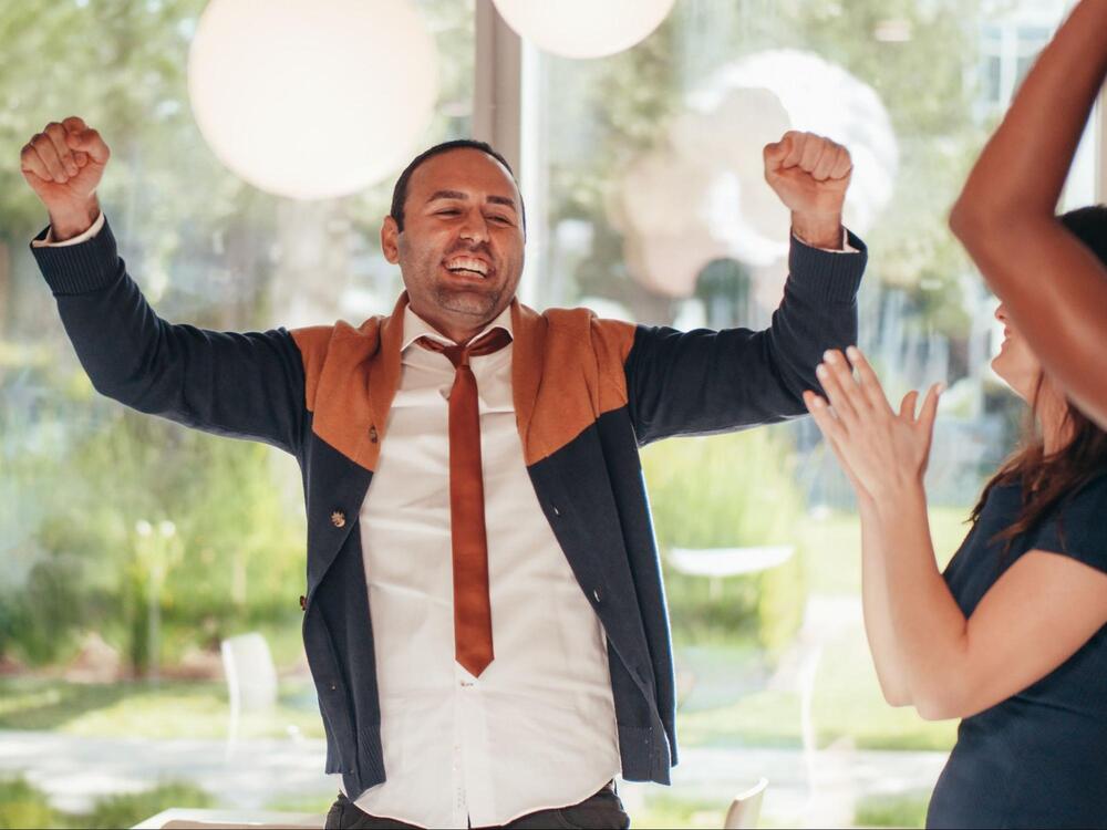 An employee feeling happy and recognized for his work
