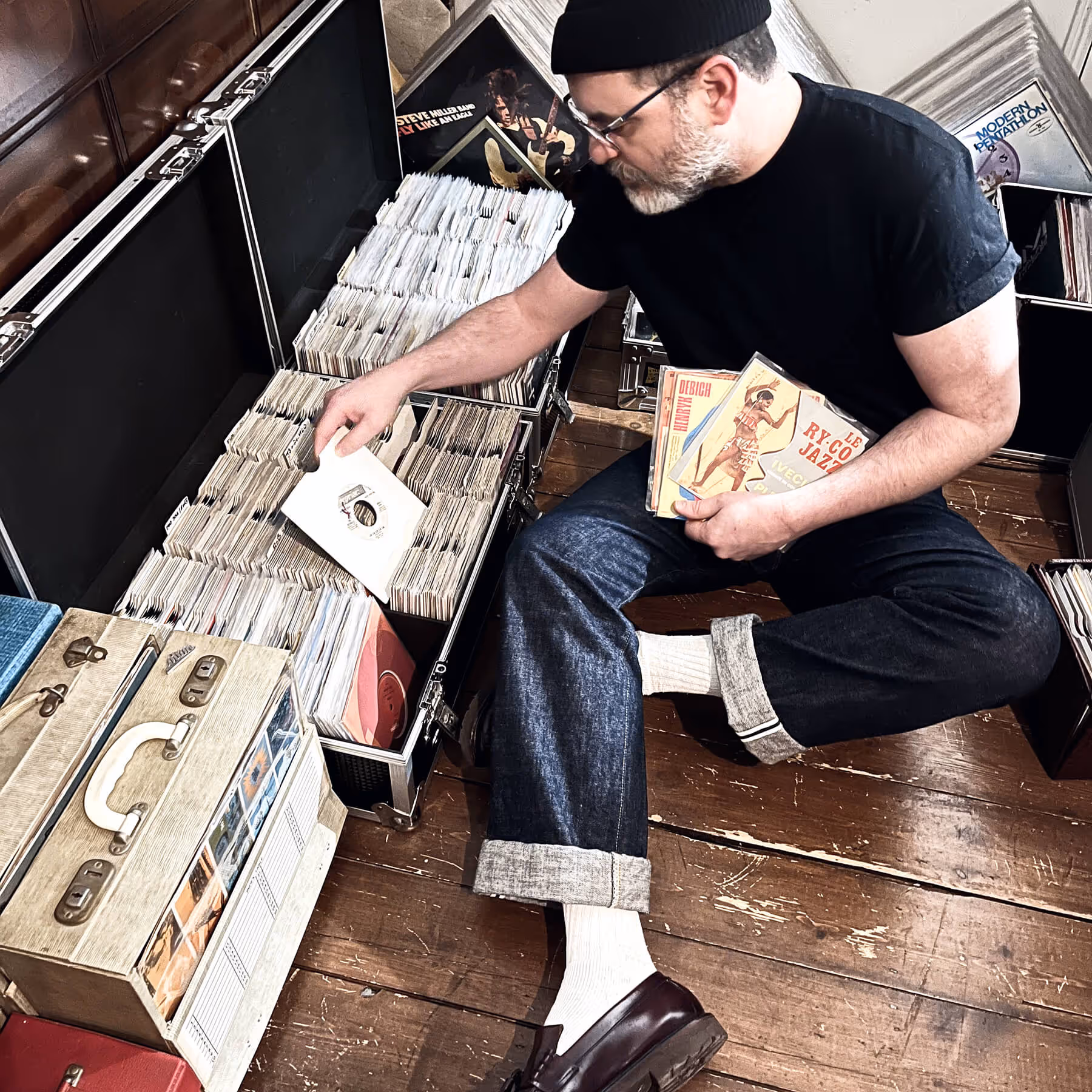 A picture of me, Simon Foster, I'm sitting on the floor looking through my records