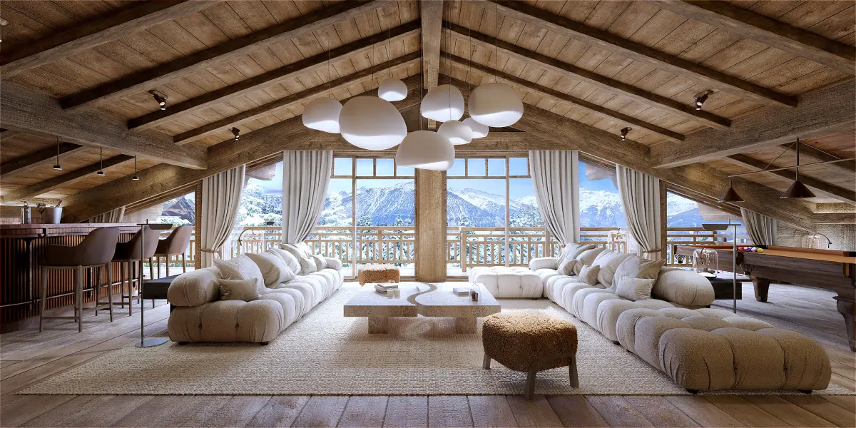Chalet E. à Courchevel 1850, intérieur salon ambiance chalet de montagne qui présente un grand salon sous les toits avec les poutres en bois apparentes au plafond