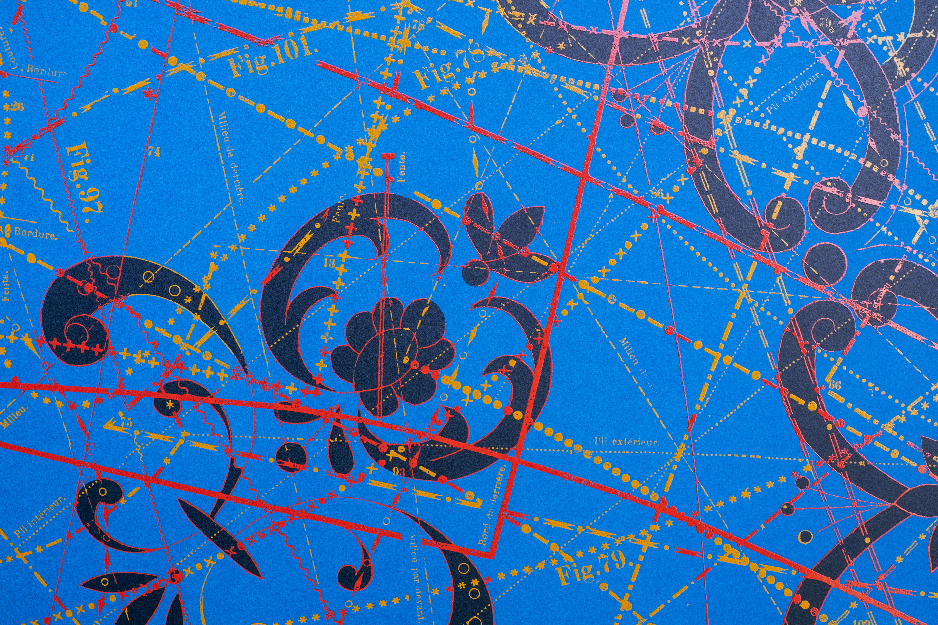 Detail of Between the Garden Lines (Blue) — navy scrolls around a flower rosette, crossed by red and gold lines on cobalt