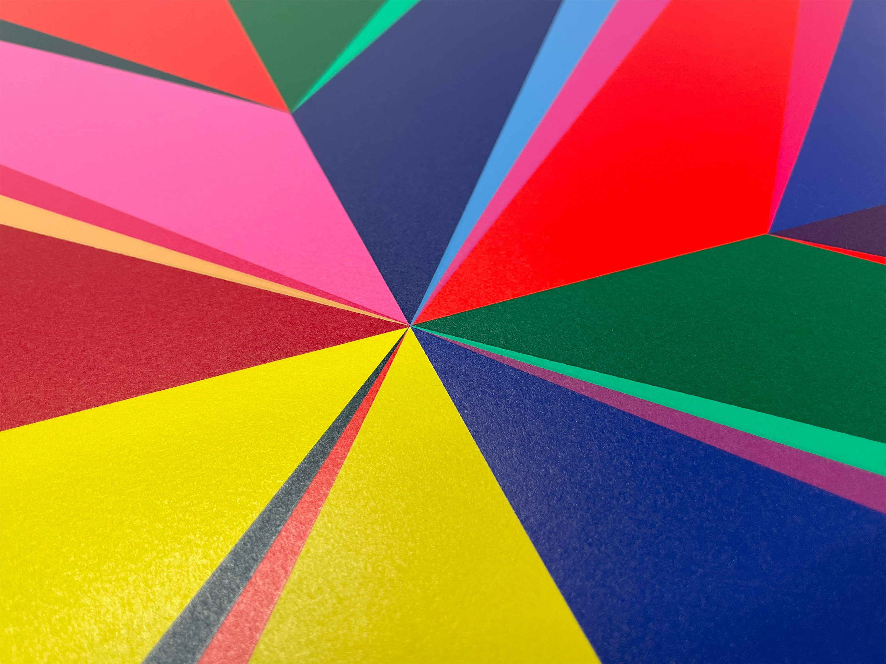 Detail of Odili Donald Odita's Black Star showing raised screenprint colour meeting at fine points, red, pink, yellow and blue.